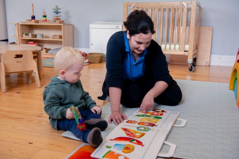 staff-reading-book-with-child-playing-toy