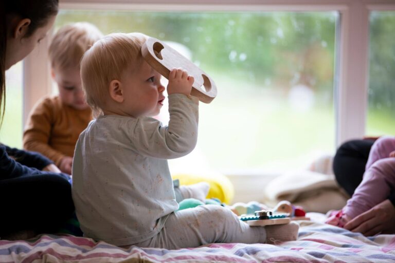 Toddlers Playing with Wooden Toys