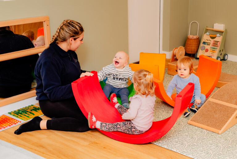 Children Playing with Practitioner on Soft Rocker
