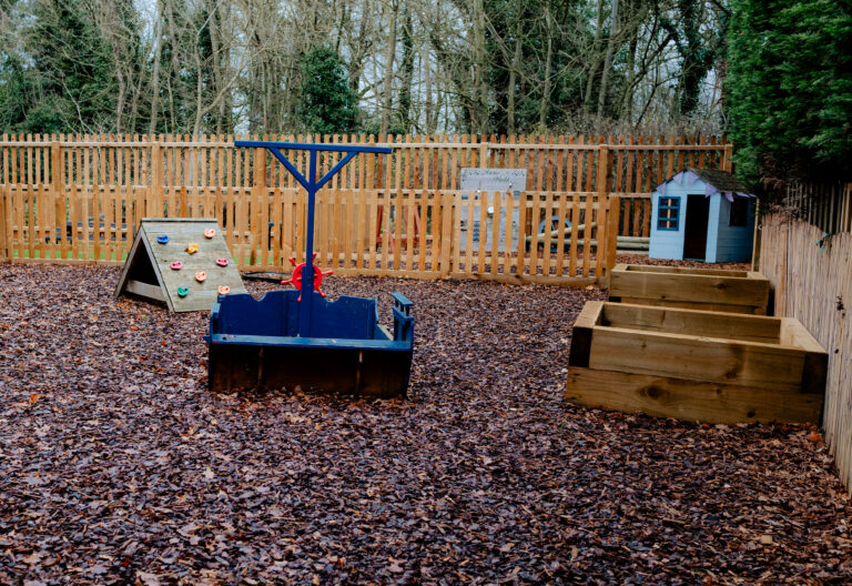Outdoor Nursery Play Area with Wooden Equipment
